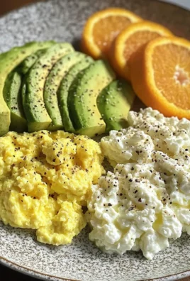 Avocado, Scrambled Eggs & Cottage Cheese Plate with Fresh Orange
